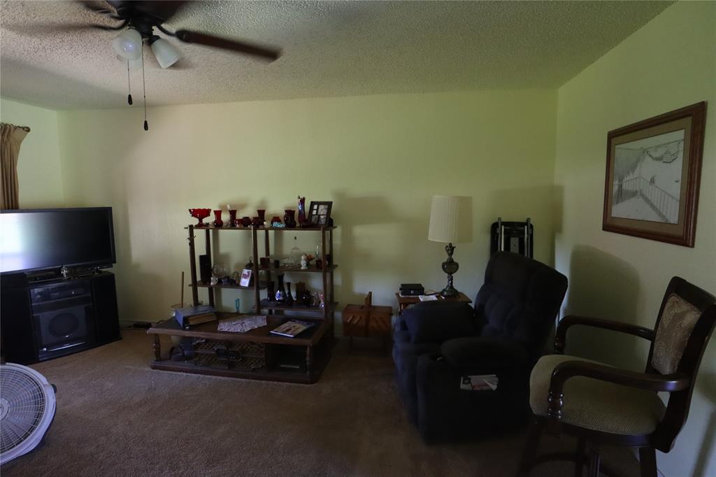 39 Oakcrest Drive Ranger, TX 76470 - Photo 7 of 25 a living room with furniture and a flat screen tv
