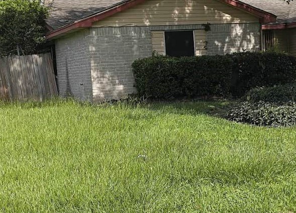 11831 Bee Lane Houston, TX 77067 - Photo 2 of 6 a front view of a house with a yard
