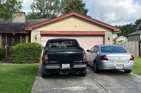 11831 Bee Lane Houston, TX 77067 - Photo 5 of 6 a front view of a house with a garden