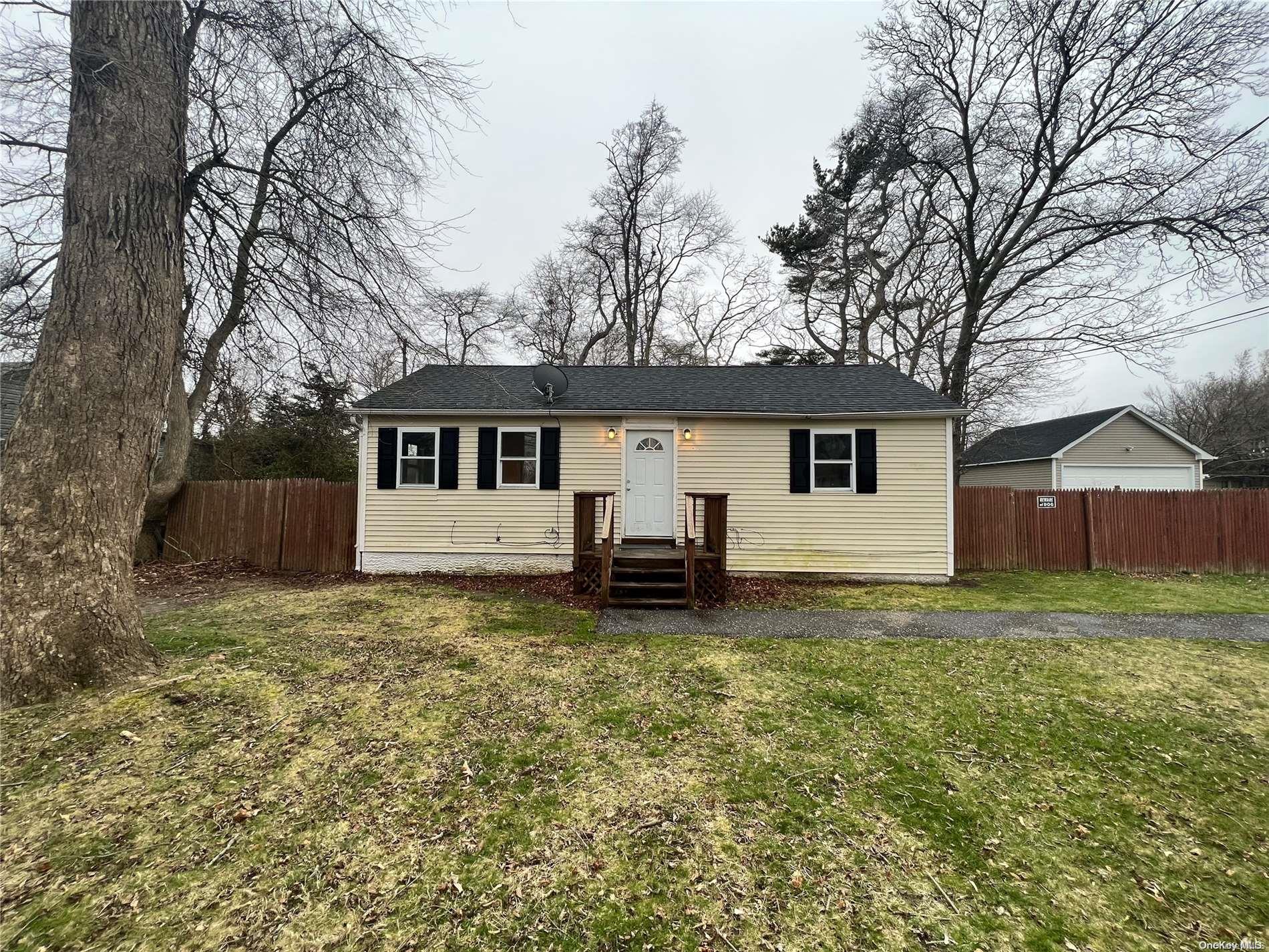 92 Monroe Drive Mastic Beach, NY 11951 - Photo 1 of 1 a view of a house with a yard