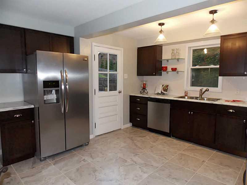 1223 Ridge Rd Extension Baden, PA 15005 - Photo 5 of 21 New large eat-in kitchen w/ceramic tile & new stainless appliances.