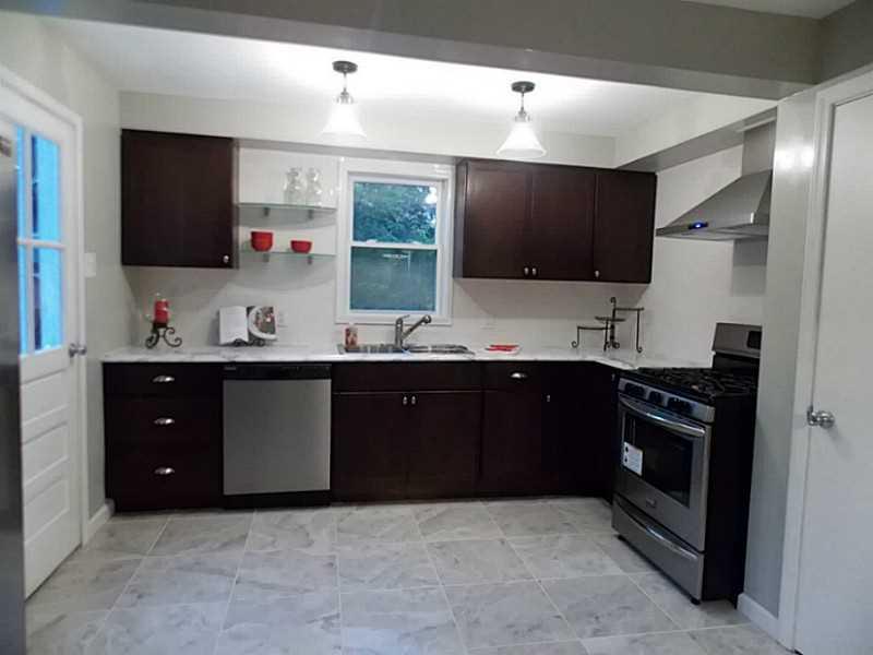 1223 Ridge Rd Extension Baden, PA 15005 - Photo 6 of 21 New large eat-in kitchen w/ceramic tile & new stainless appliances.