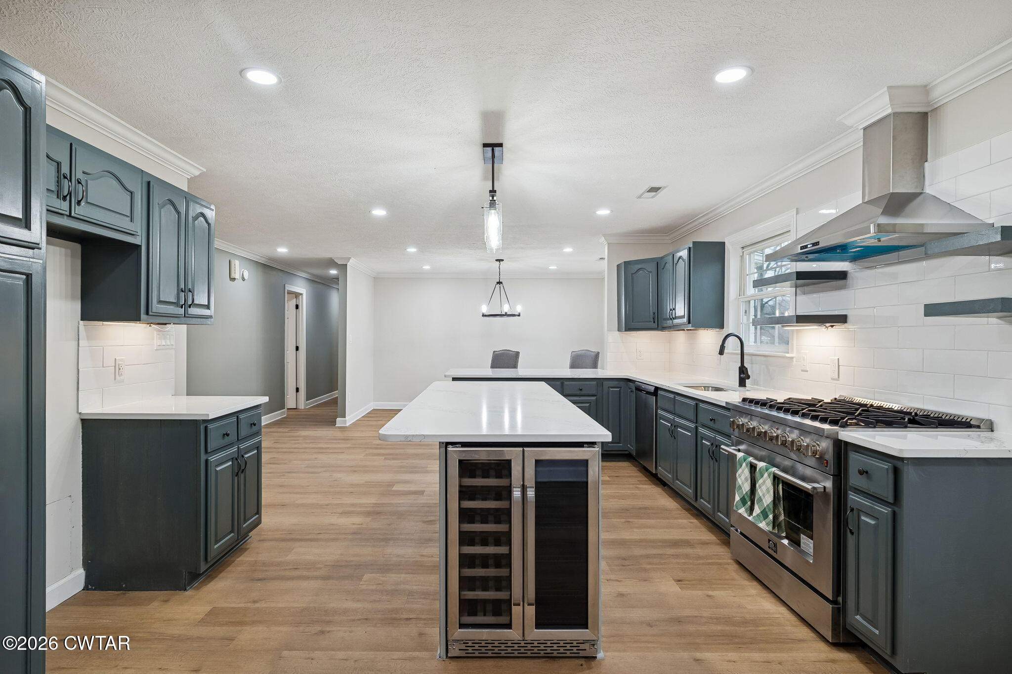 123 Walnut Hill Road Bells, TN 38006 - Photo 25 of 61 a kitchen with stainless steel appliances granite countertop a sink a stove and a wooden floors