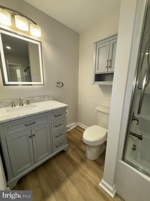 104 Stuart Avenue Downingtown, PA 19335 - Photo 16 of 30 a bathroom with a toilet a sink and mirror