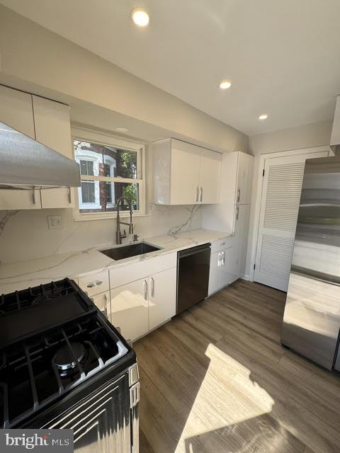 104 Stuart Avenue Downingtown, PA 19335 - Photo 6 of 30 a kitchen with granite countertop a stove and cabinets