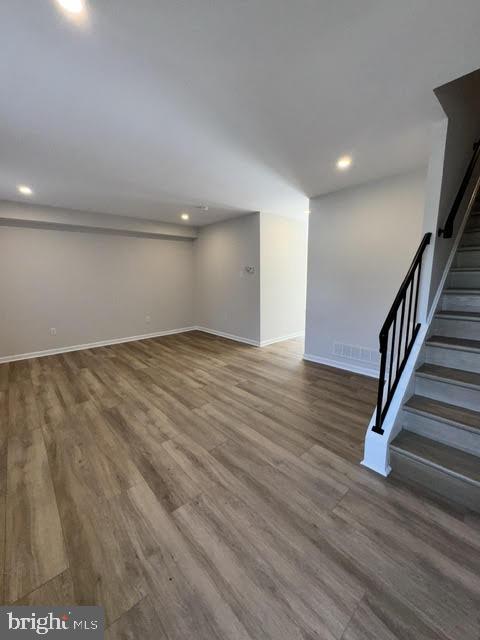 104 Stuart Avenue Downingtown, PA 19335 - Photo 10 of 30 a view of an empty room with wooden floor and stairs