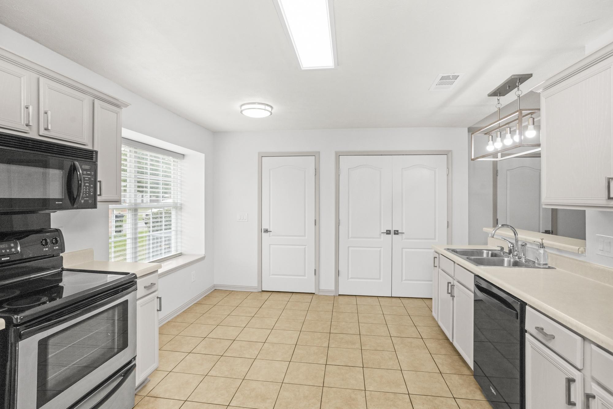 607 Mable Drive La Vergne, TN 37086 - Photo 13 of 46 a kitchen with a sink a stove and cabinets