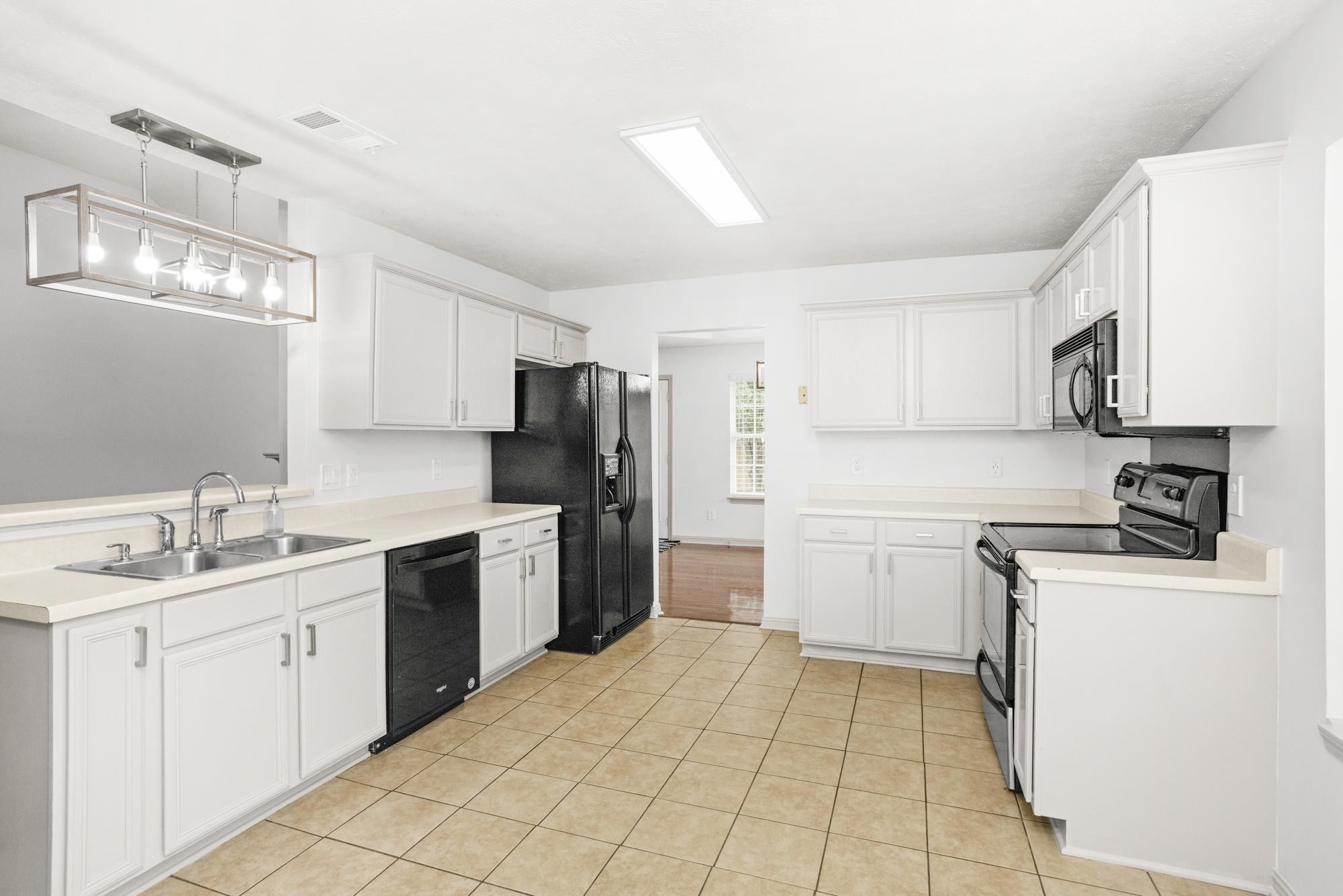 607 Mable Drive La Vergne, TN 37086 - Photo 17 of 46 a kitchen with a sink stove and refrigerator