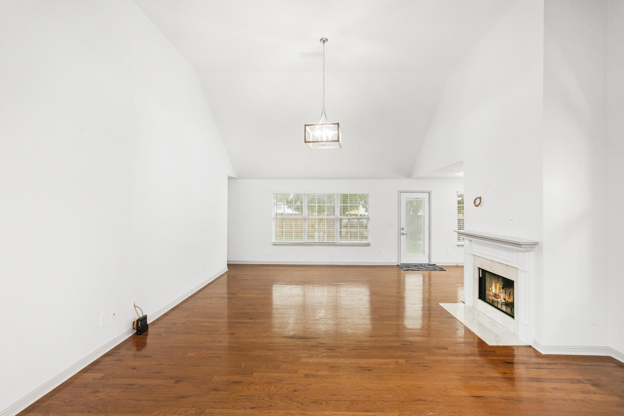 607 Mable Drive La Vergne, TN 37086 - Photo 20 of 46 a view of an empty room with wooden floor and a window