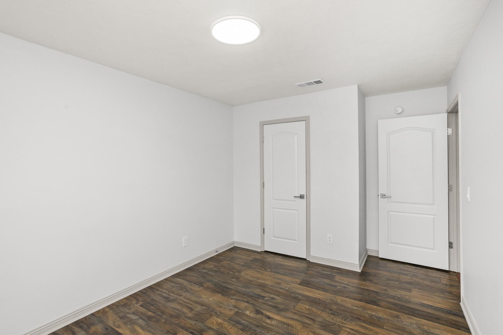 607 Mable Drive La Vergne, TN 37086 - Photo 27 of 46 a view of an empty room with wooden floor
