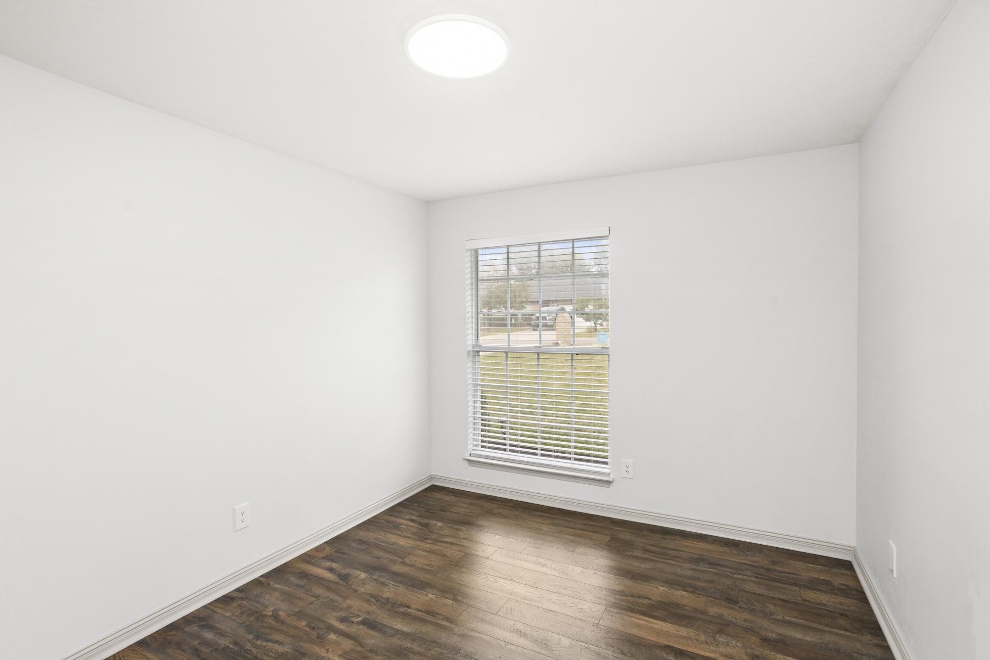 607 Mable Drive La Vergne, TN 37086 - Photo 28 of 46 a view of an empty room with wooden floor and a window