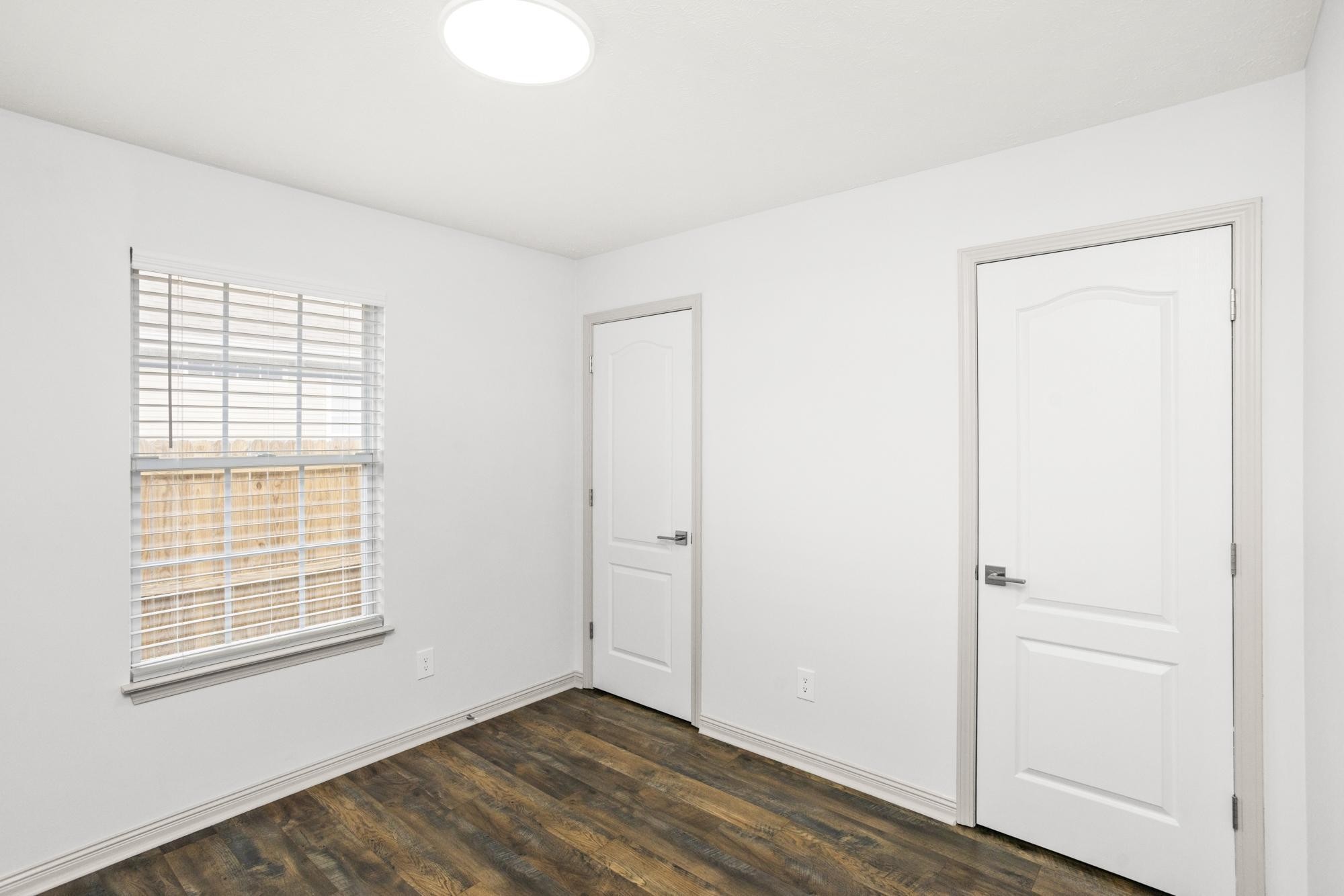607 Mable Drive La Vergne, TN 37086 - Photo 29 of 46 an empty room with wooden floor and windows