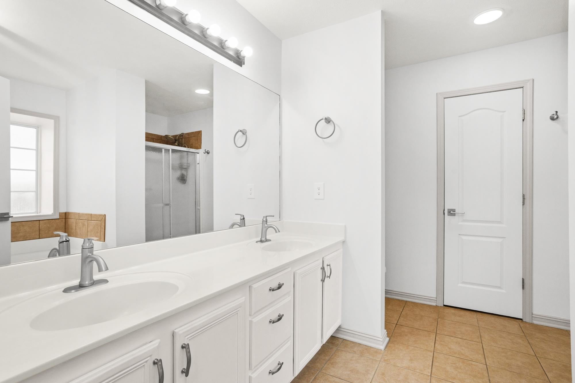 607 Mable Drive La Vergne, TN 37086 - Photo 38 of 46 a spacious bathroom with a double vanity sink and a mirror