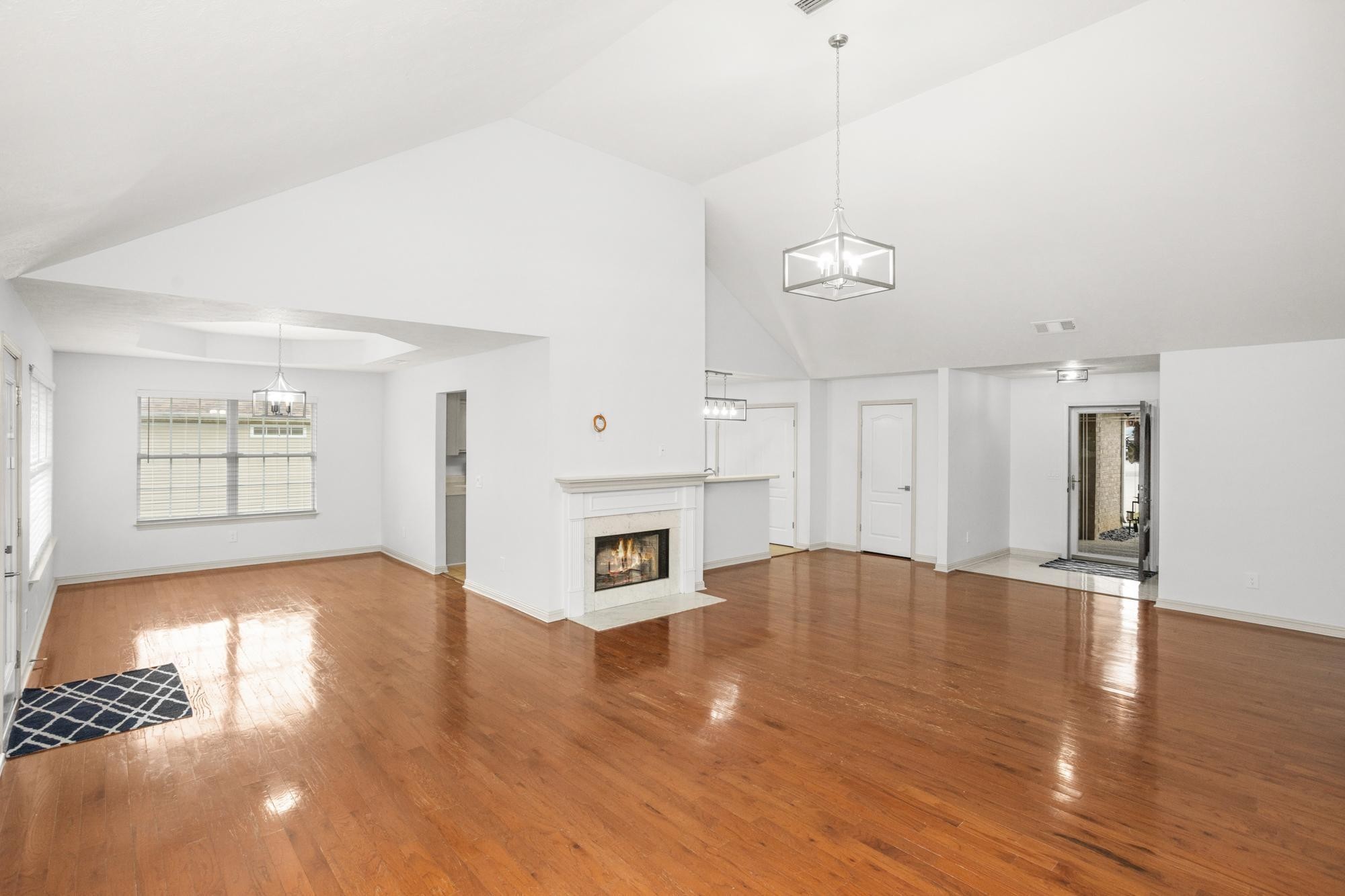 607 Mable Drive La Vergne, TN 37086 - Photo 8 of 46 a view of a livingroom with a fireplace a ceiling fan and windows