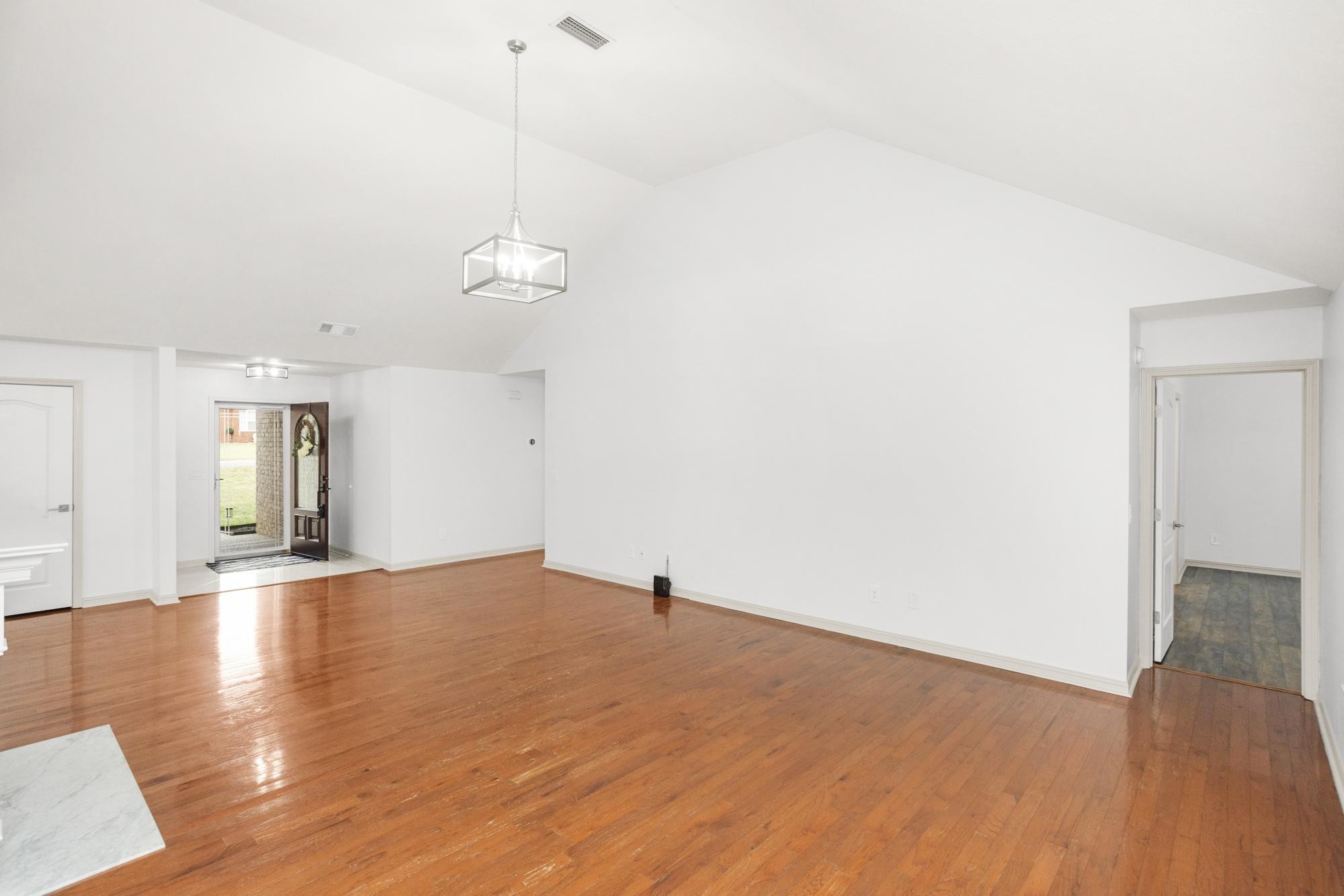 607 Mable Drive La Vergne, TN 37086 - Photo 9 of 46 a view of a room with wooden floor and a ceiling fan