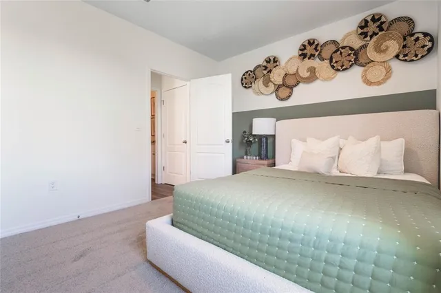 a bedroom with a bed and cabinets