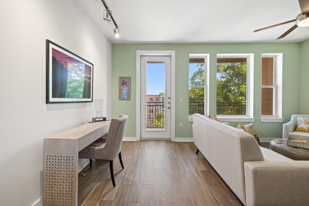 1900 Barton Springs Road, Unit 5009 Austin, TX 78704 - Photo 12 of 35 Sun-filled interior with direct access to a balcony, perfect for vibrant indoor-outdoor living.