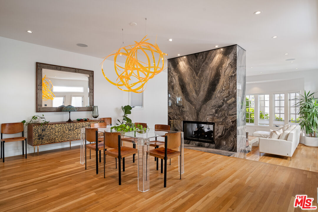 128 Roma Court Marina del Rey, CA 90292 - Photo 16 of 52 a living room with fireplace furniture and a wooden floor