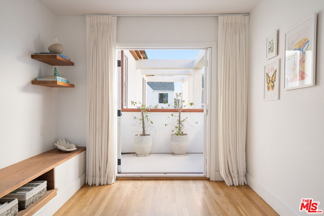 128 Roma Court Marina del Rey, CA 90292 - Photo 26 of 52 a view of a hallway with wooden floor and closet