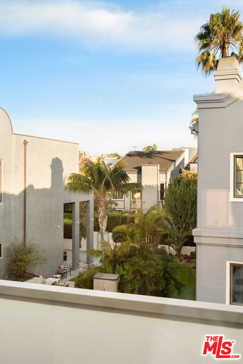 128 Roma Court Marina del Rey, CA 90292 - Photo 30 of 52 a front view of a house with a yard