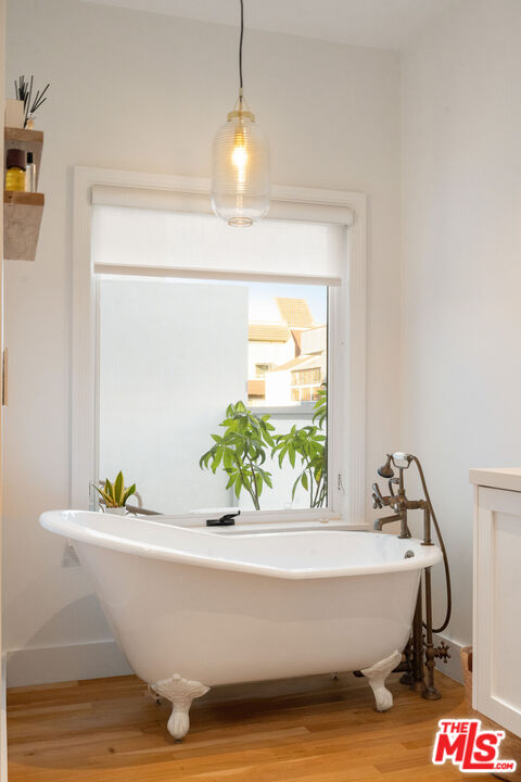 128 Roma Court Marina del Rey, CA 90292 - Photo 32 of 52 a white tub sitting in a bathroom next to a window