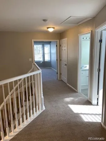 a bathroom with a granite countertop tub sink and mirror