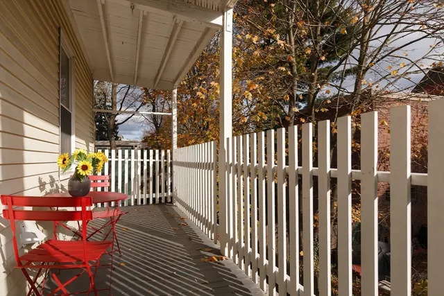 a view of a porch with wooden floor