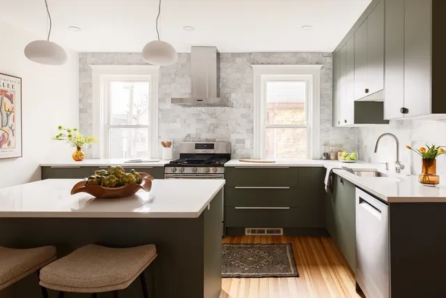 a kitchen with a sink stove and window