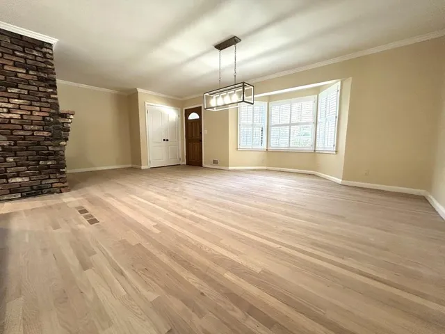 a kitchen with kitchen island granite countertop a sink a counter space and stainless steel appliances