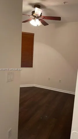 a bathroom with a toilet and shower