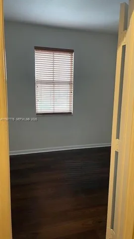 a bathroom with a sink toilet and mirror