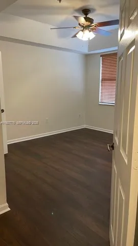 a bathroom with a granite countertop shower and a sink