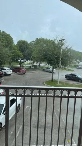 a view of a street with cars