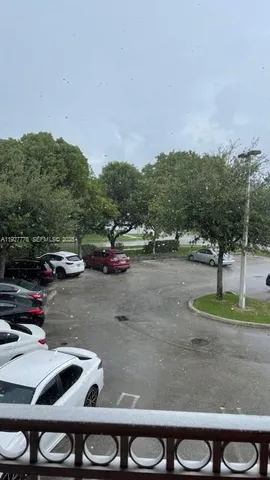 a view of a brick house with a yard