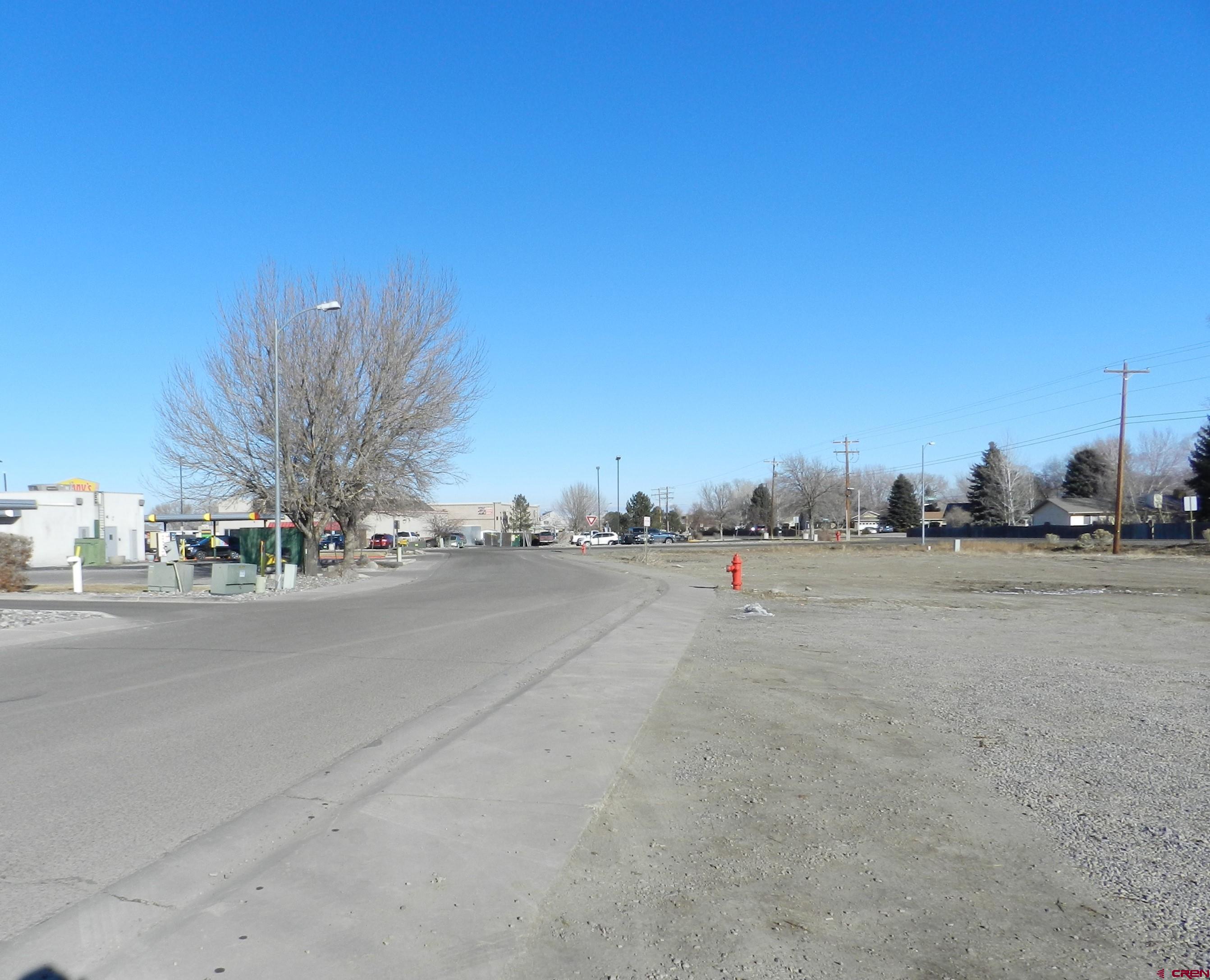 Tbd Woodgate Road Montrose, CO 81401 - Photo 15 of 20 a view of road and houses