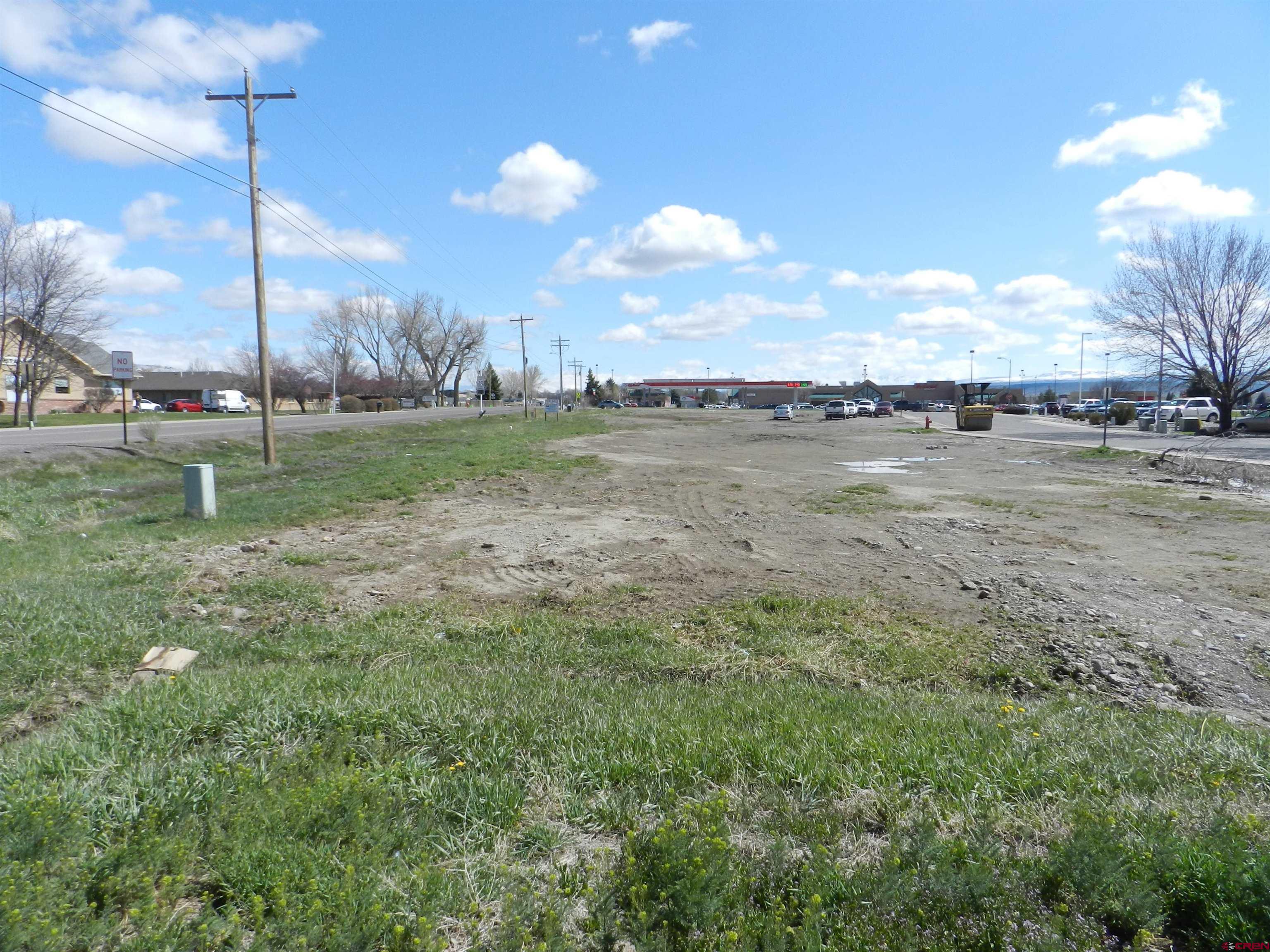 Tbd Woodgate Road Montrose, CO 81401 - Photo 3 of 20 a view of a lake with a big yard