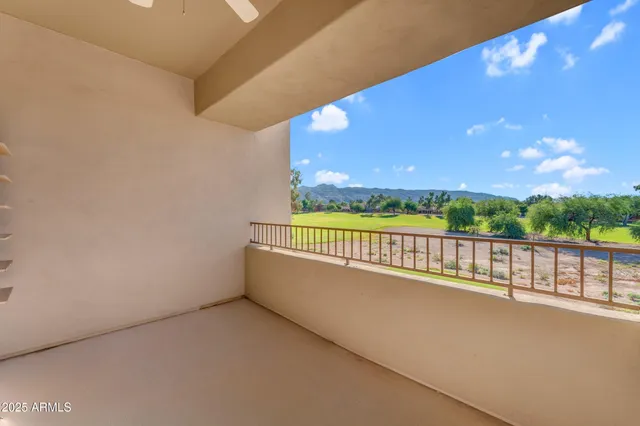 a view of balcony with furniture and garden