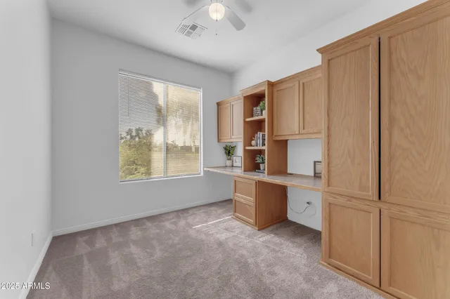 a kitchen with stainless steel appliances a refrigerator sink and cabinets