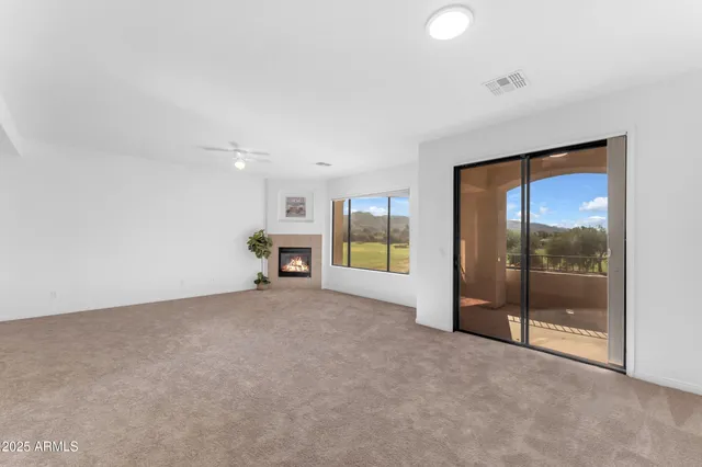 a view of an empty room with glass door