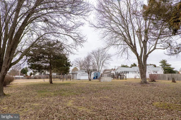 a view of a house with a snow in the yard