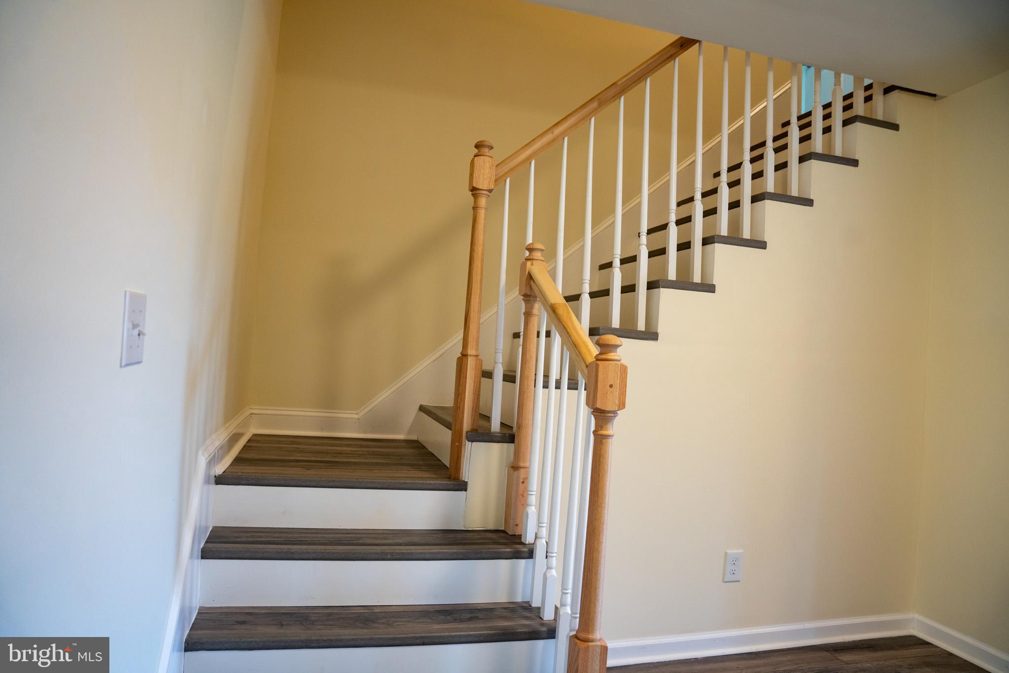 29592 Foskey Lane Delmar, MD 21875 - Photo 14 of 65 Inviting staircase with warm wooden accents.