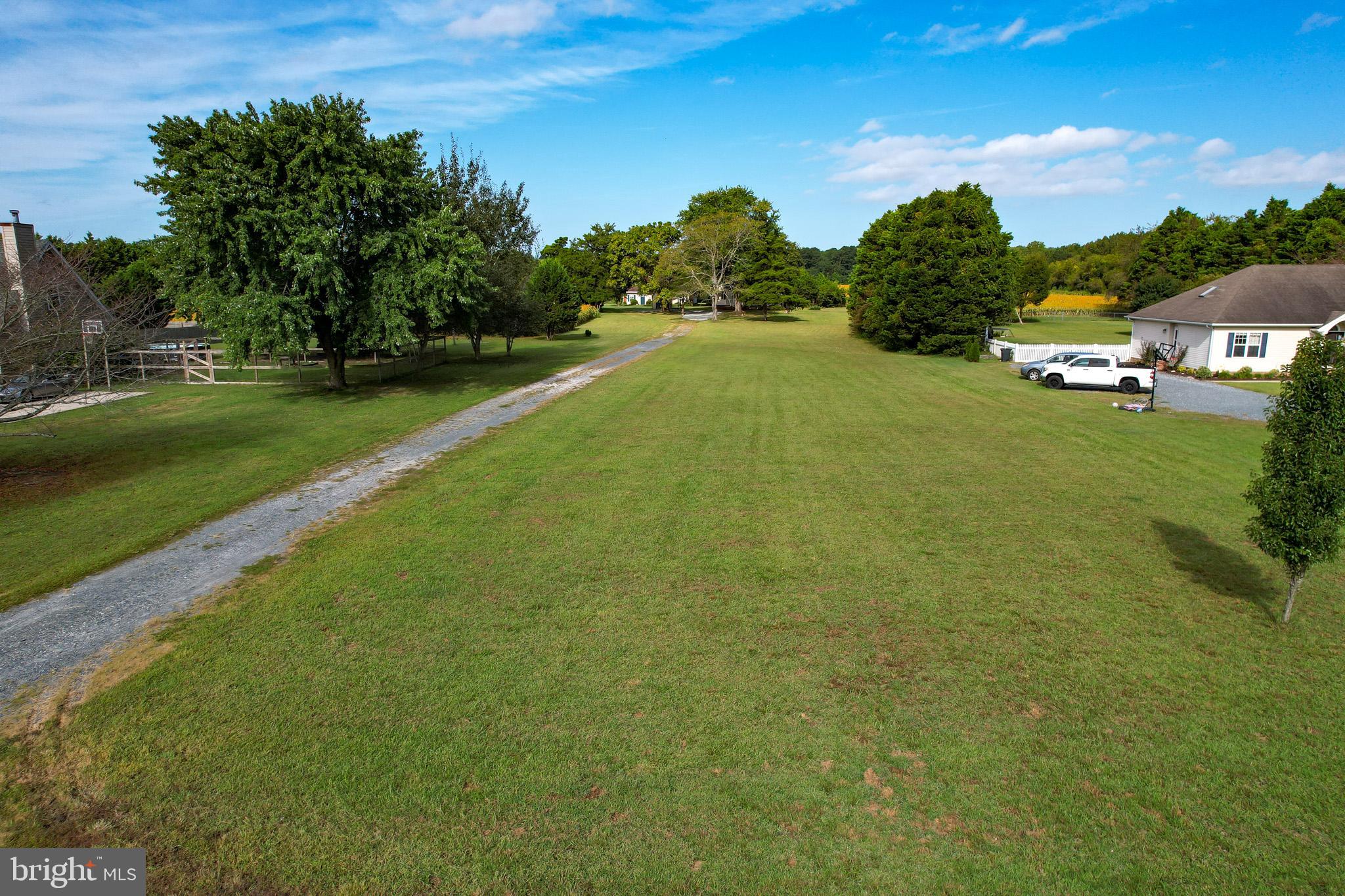 29592 Foskey Lane Delmar, MD 21875 - Photo 38 of 65 Spacious green landscape with serene pathways.