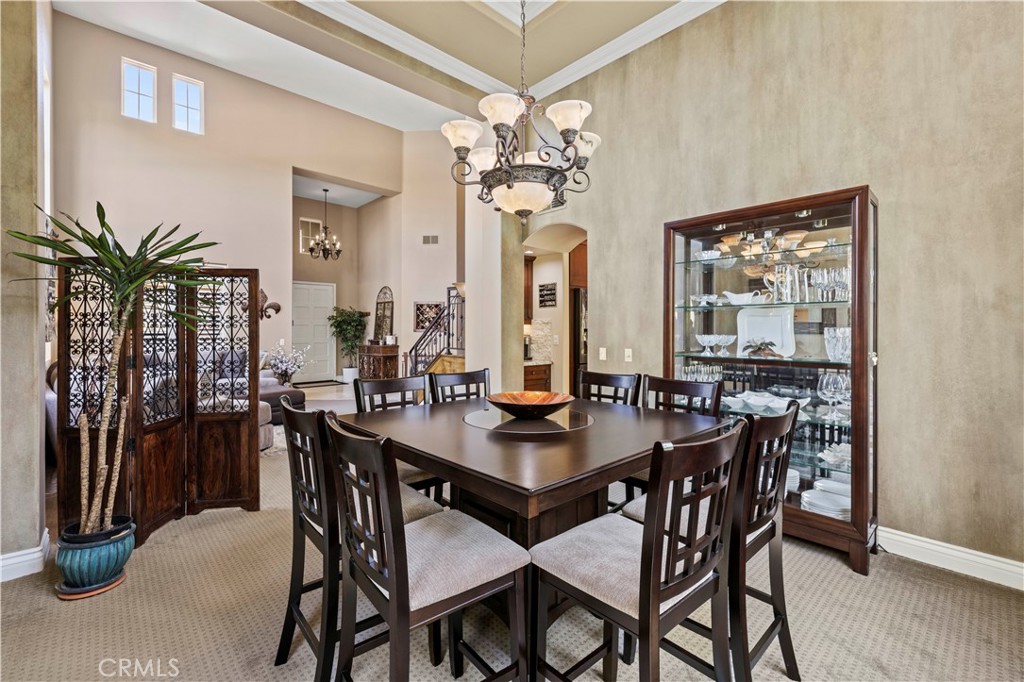 25221 Summerhill Lane Stevenson Ranch, CA 91381 - Photo 12 of 74 a view of a dining room with furniture window and wooden floor