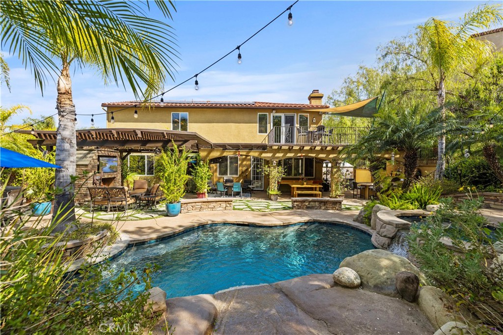 25221 Summerhill Lane Stevenson Ranch, CA 91381 - Photo 2 of 74 a view of a swimming pool with a patio