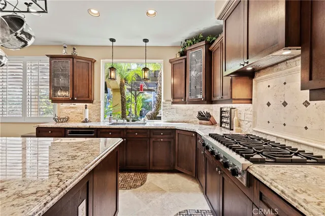 a living room with furniture a flat screen tv and a large window