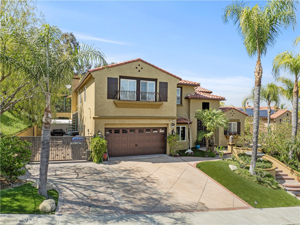 25221 Summerhill Lane Stevenson Ranch, CA 91381 - Photo 4 of 74 a front view of a house with a yard