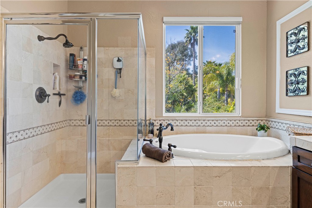 25221 Summerhill Lane Stevenson Ranch, CA 91381 - Photo 48 of 74 a bathroom with a tub and a shower
