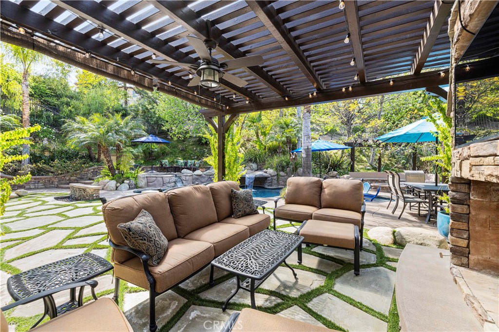 25221 Summerhill Lane Stevenson Ranch, CA 91381 - Photo 55 of 74 a outdoor living space with patio furniture and a garden
