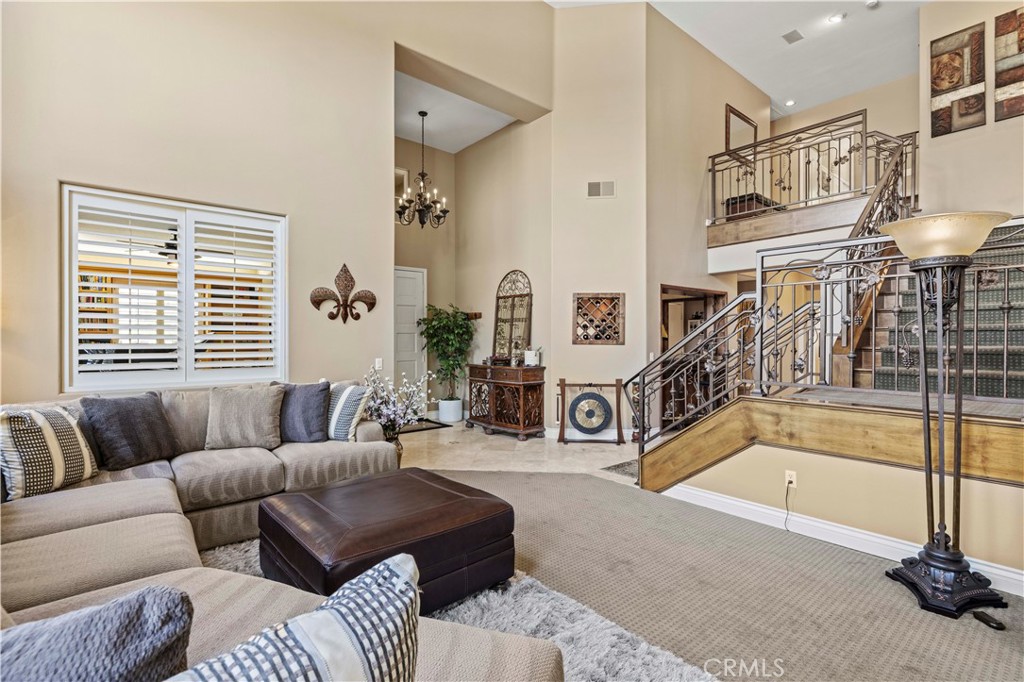 25221 Summerhill Lane Stevenson Ranch, CA 91381 - Photo 8 of 74 a living room with furniture and a floor to ceiling window