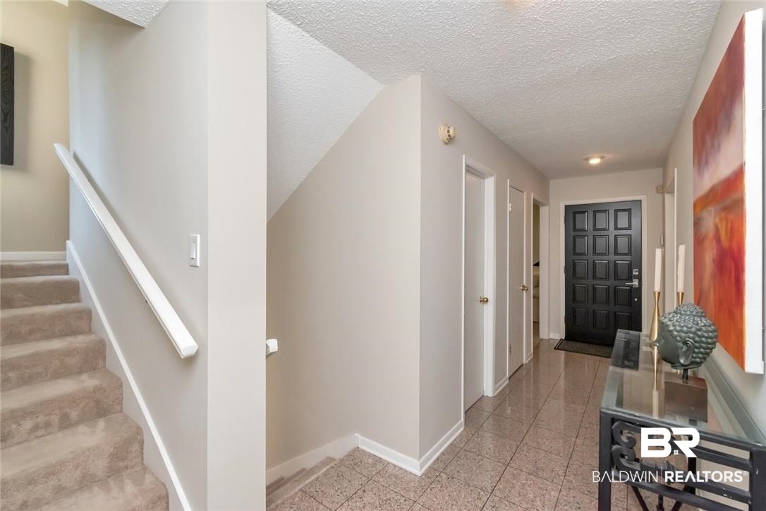 305 Fern Hill Court Mobile, AL 36608 - Photo 21 of 53 Hallway with a textured ceiling